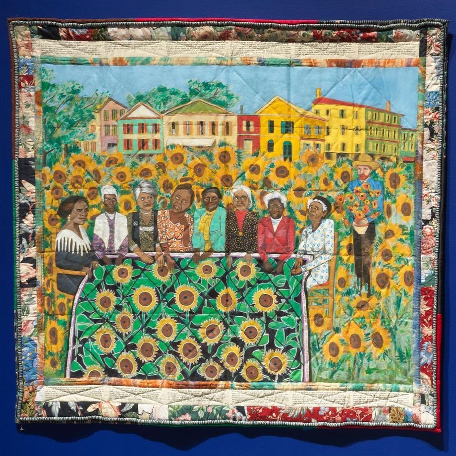 Faith Ringgold's The Sunflowers Quilting Bee at Arles: The French Collection Part I, #4, quilt depicting iconic Black women like Madame C.J. Walker, Harriet Tubman, Rosa Parks, and Ella Baker gathered in a field of sunflowers with Vincent Van Gogh observing them from the sideline